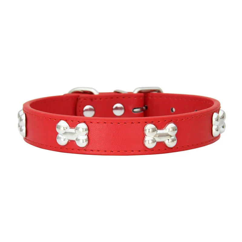Nini, collier en cuir pour chiens notamment petits chiens, orné de l'os en métal. Existe en plusieurs couleurs.